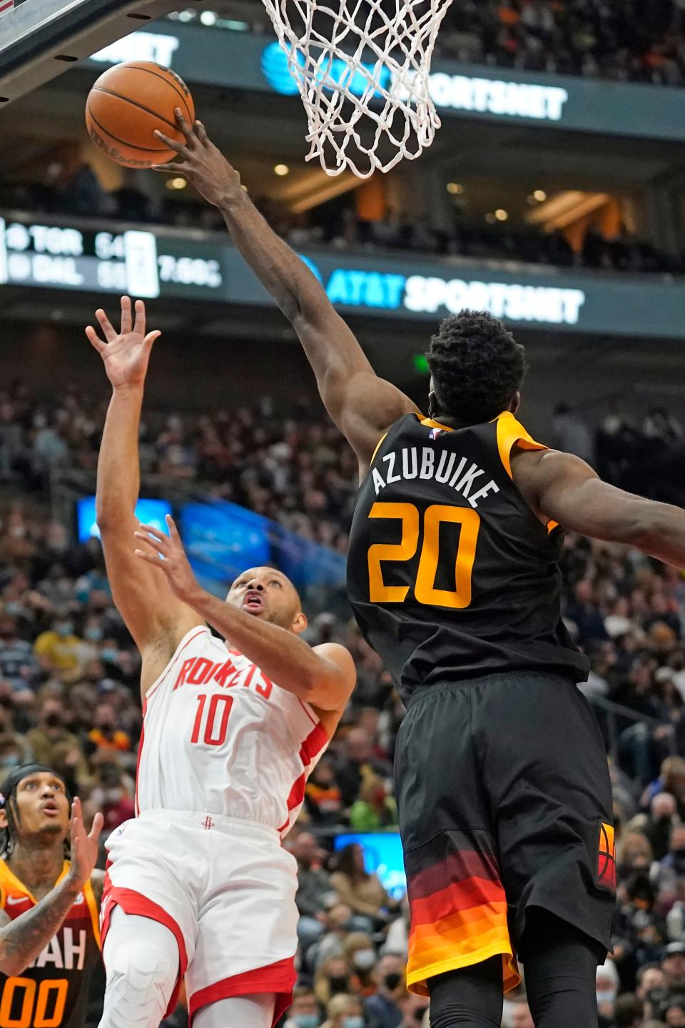 Utah Jazz center Udoka Azubuike (20) blocks the shot of Houston Rockets guard Eric Gordon (10) in the first half during an NBA basketball game Wednesday, Jan. 19, 2022, in Salt Lake City. (AP Photo/Rick Bowmer)