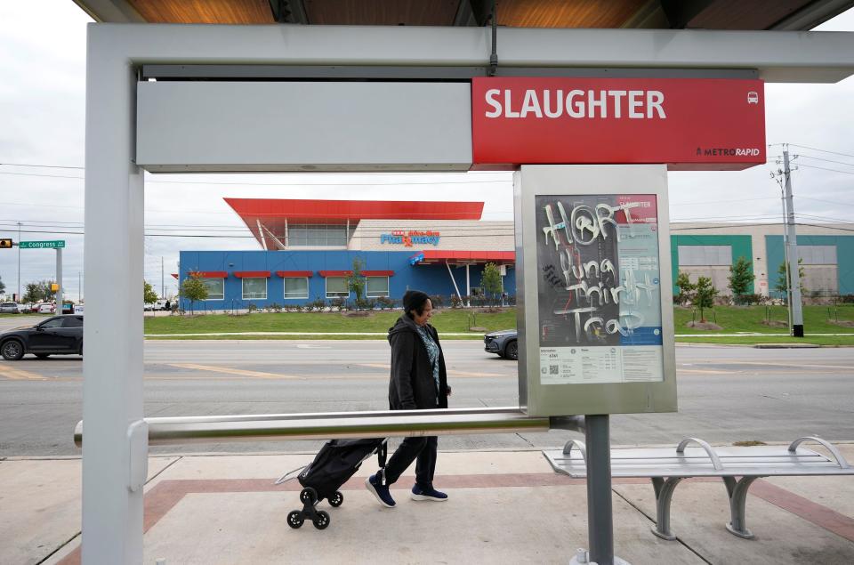 Irene Ray walks away with her groceries at the H-E-B on South Congress Avenue near Slaughter Lane to a nearby bus stop on Tuesday November 21, 2023. Ray rides a bus from her home in Del Valle to get groceries at the H-E-B.