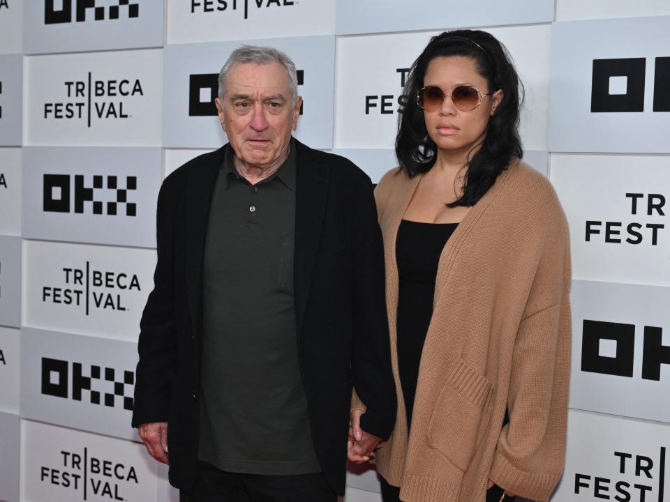 Robert De Niro and his girlfriend Tiffany Chen arrive to the screening of "Kiss the Future" during the opening night of the Tribeca Film Festival at OKX Theater in New York City on June 7, 2023.