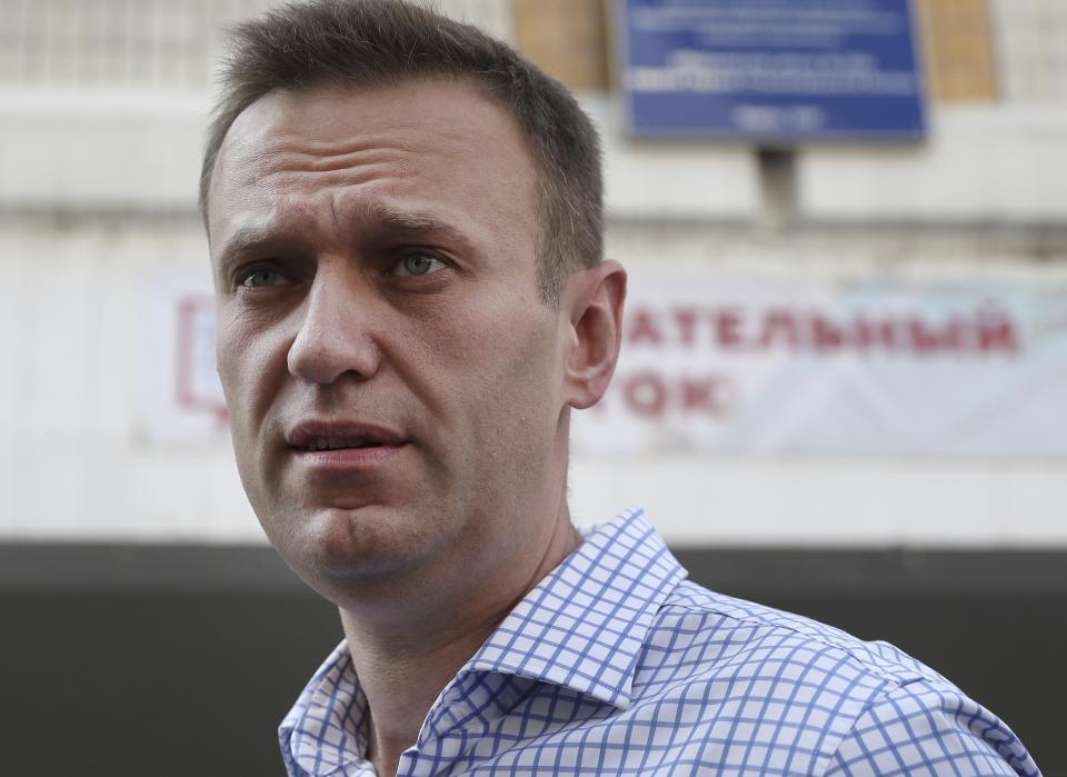 Russian opposition leader Alexei Navalny speaks to media after voting during a city council election in Moscow, Russia, Sunday, Sept. 8, 2019. Residents of Russia's capital are voting in a city council election that is shadowed by a wave of protests that saw the biggest demonstrator turnout in seven years and a notably violent police response. (AP Photo/Andrew Lubimov)