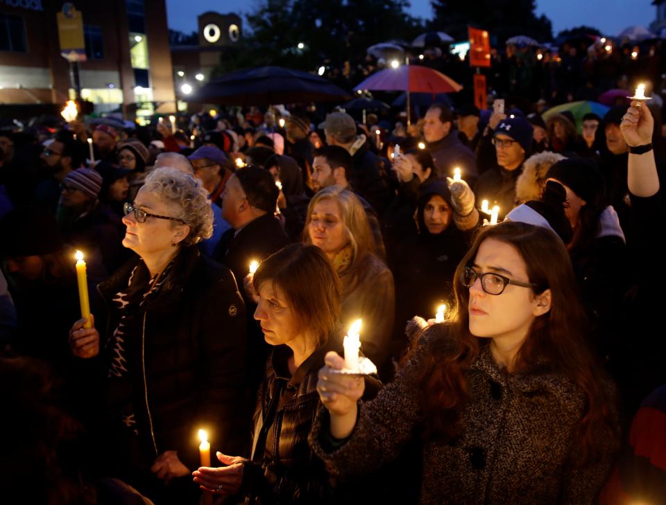 People hold candles as they gather for a vigil in the aftermath of a deadly shooting at the Tree of Life Congregation, in the Squirrel Hill neighborhood of Pittsburgh, Oct. 27, 2018.