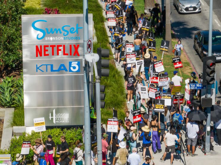 LOS ANGELES, CA - JULY 14: SAG-AFTRA members take to the picket line outside Netflix on Sunset Boulevard and Van Ness Avenue in Los Angeles, CA on Friday, July 14, 2023. Actors join striking writers who have been on the picket lines since the beginning of May. (Myung J. Chun / Los Angeles Times)