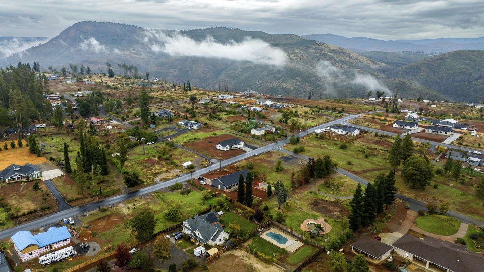 Empty lots and homes built since the Camp Fire line a neighborhood on the east side of Paradise, Calif., Wednesday, Oct. 25, 2023. (AP Photo/Noah Berger)