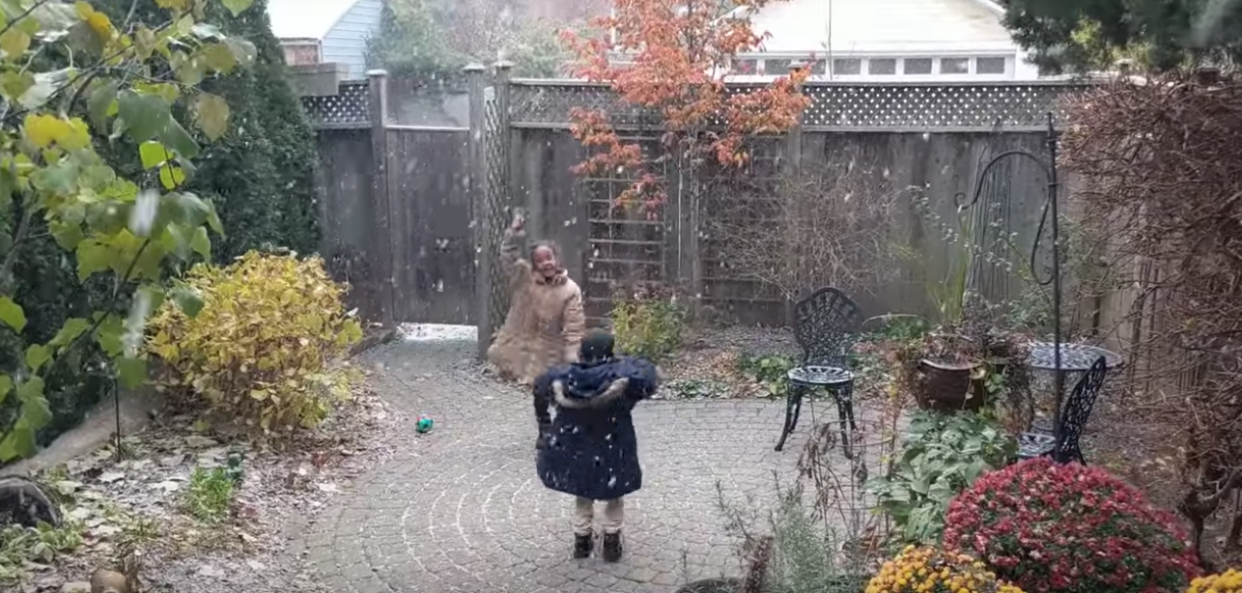 Children dance in the snow for the first time in Toronto. (Photo: Rebecca Davies via YouTube)