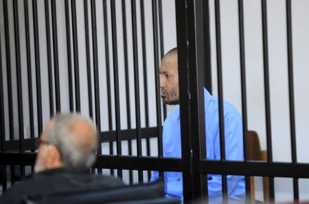 Saadi Gaddafi, son of Muammar Gaddafi, sits behind bars during a hearing at a courtroom in Tripoli, Libya November 1, 2015. REUTERS/Ismail Zitouny