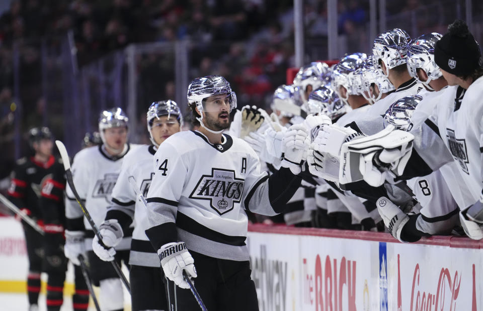 Los Angeles Kings center Phillip Danault (24) is congratulated for his goal against the Ottawa Senators during the first period of an NHL hockey game Thursday, Nov. 2, 2023, in Ottawa, Ontario. (Sean Kilpatrick/The Canadian Press via AP)