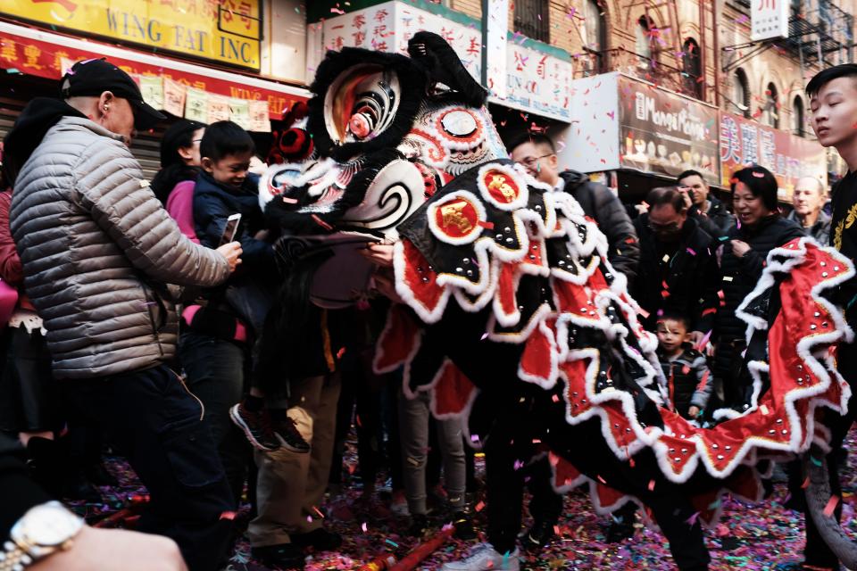 People celebrate the Lunar New Year in Chinatown in New York City in 2019. Thousands of members of the Chinese American community, tourists and other New Yorkers took to the streets to celebrate the first day of the Lunar New Year, China's biggest holiday of the year. That year was the "Year of the Pig."