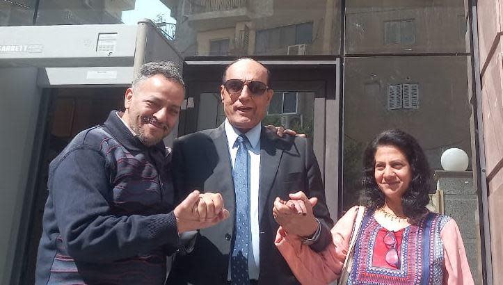 Attorney Naguib Gebrael stands between his clients, Farouk Fawzi Boulos and his wife Amal Ibrahim, outside a court in Cairo, Egypt. / Credit: Photo courtesy of Naguib Gebrael