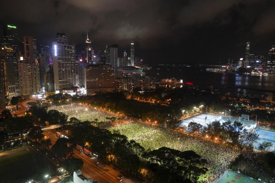 FILE - In this June 4, 2020, file photo, supporters gather for a vigil for the victims of the 1989 Tiananmen Square Massacre at Victoria Park in Causeway Bay, Hong Kong, despite applications for it being officially denied. Hong Kong authorities for the second year have banned the June 4 candlelight vigil to commemorate the bloody crackdown on pro-democracy protests in Beijing’s Tiananmen Square in 1989, organizers said Thursday, May 27, 2021. (AP Photo/Vincent Yu)