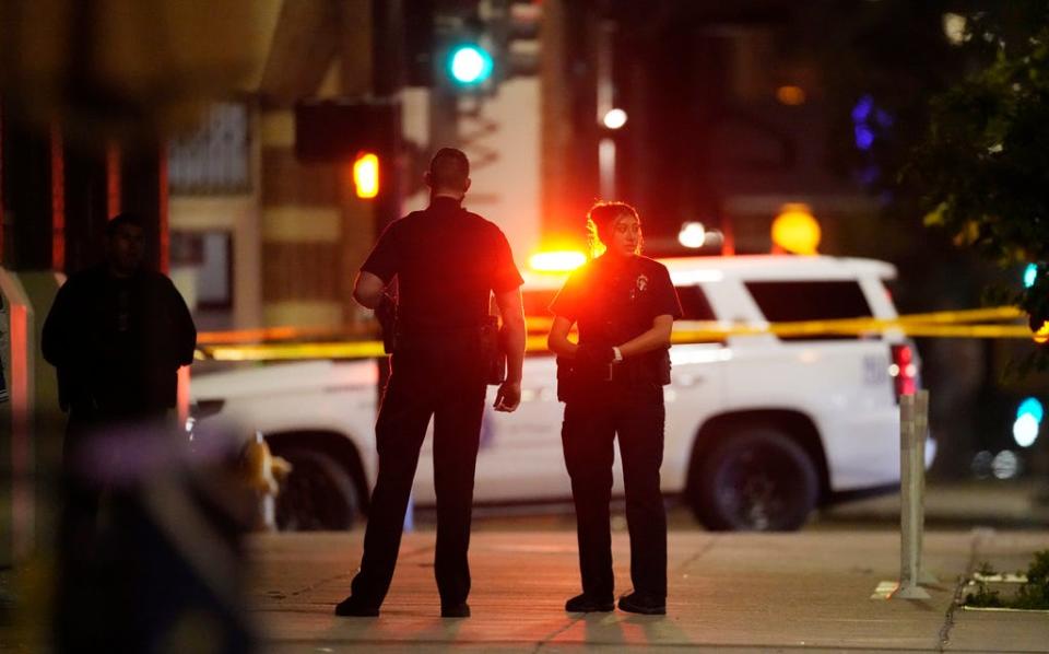Denver Police Department investigators work the scene of a shooting June 13, 2023, in Denver.