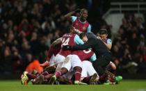 Football Soccer- West Ham United v Liverpool - FA Cup Fourth Round Replay - Upton Park - 9/2/16 Angelo Ogbonna celebrates with team mates after scoring the second goal for West Ham Action Images via Reuters / Matthew Childs Livepic EDITORIAL USE ONLY.