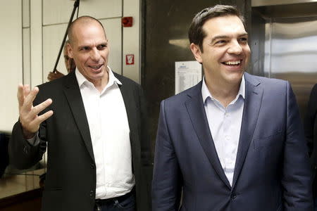 Greek Finance Minister Yanis Varoufakis (L) welcomes Prime Minister Alexis Tsipras for a meeting at the ministry in Athens, Greece May 27, 2015. REUTERS/Alkis Konstantinidis