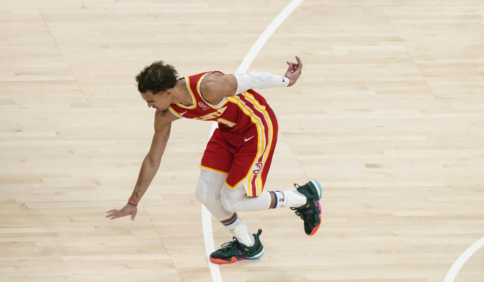 Atlanta Hawks guard Trae Young (11) celebrates after shooting and scoring against the New York Knicks during the second half in Game 3 of an NBA basketball first-round playoff series Friday, May 28, 2021, in Atlanta. (AP Photo/Brynn Anderson)