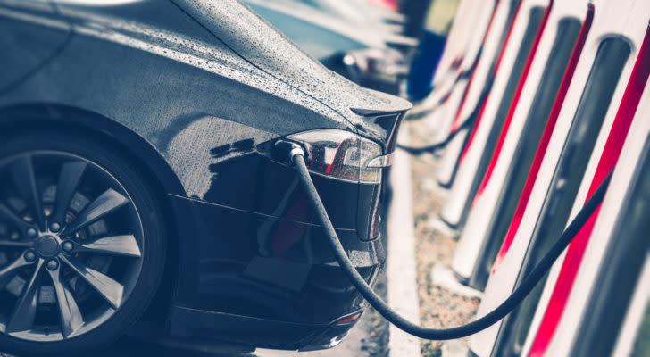 Electric Cars Charging Station Closeup Photo. Vehicle Rechargeable Batteries Charing. Future of Transportation. Chinese EV stocks