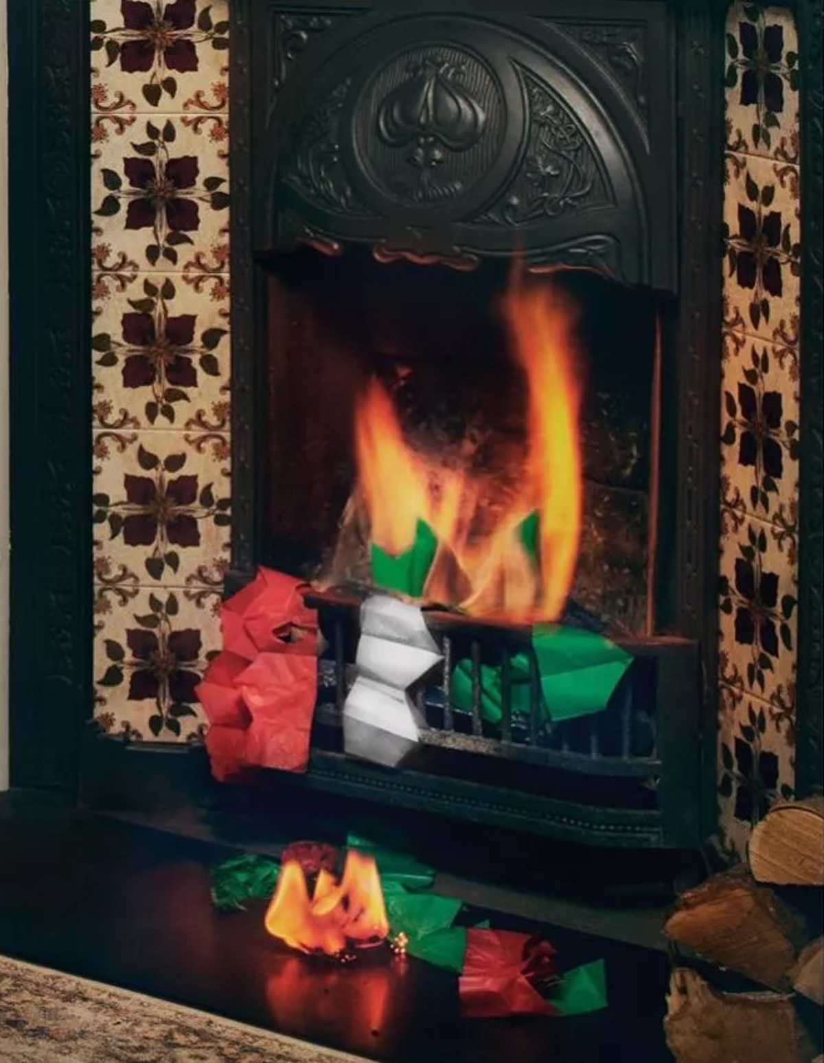 Christmas paper party hats burning in a fireplace in the M&S advert (Instagram / @marksandspencer)