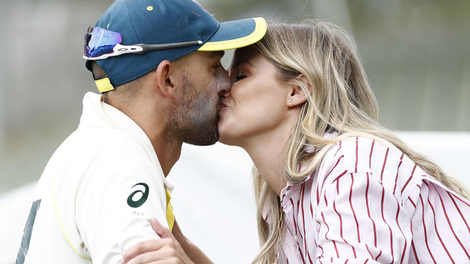 Nathan Lyon celebrates victory in the first Test with a kiss from partner Emma McCarthy. (Photo by Ryan Pierse/Getty Images)