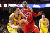 Minnesota guard Payton Willis (0) goes to the basket around Ohio State guard Malaki Branham (22) in the first half of an NCAA college basketball game Thursday, Jan. 27, 2022, in Minneapolis. (AP Photo/Bruce Kluckhohn)