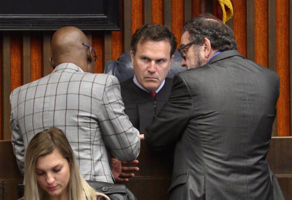 Left to right, District Attorney Stacey Jackson, Judge John Martin and public defender Steve Craft confer during Jayvon Hatchett’s assault trial.