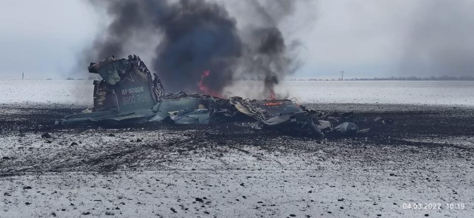 A crashed jet with black smoke.