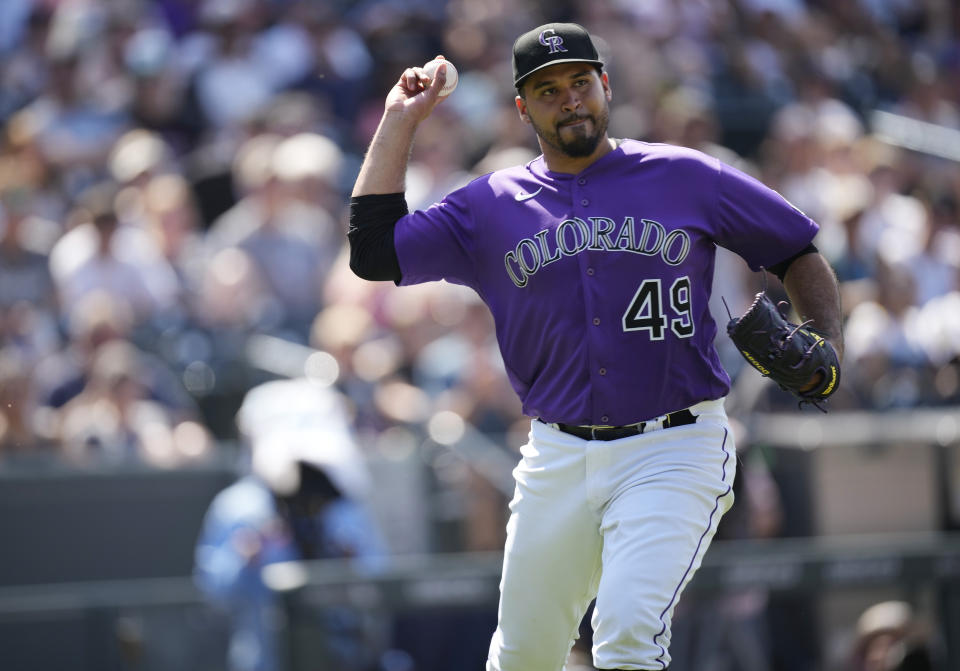 Colorado Rockies starting pitcher Antonio Senzatela looks to throw the ball after taking a single off the right shin off the bat of Chicago White Sox's Leury Garcia in the seventh inning of a baseball game Wednesday, July 27, 2022, in Denver. (AP Photo/David Zalubowski)