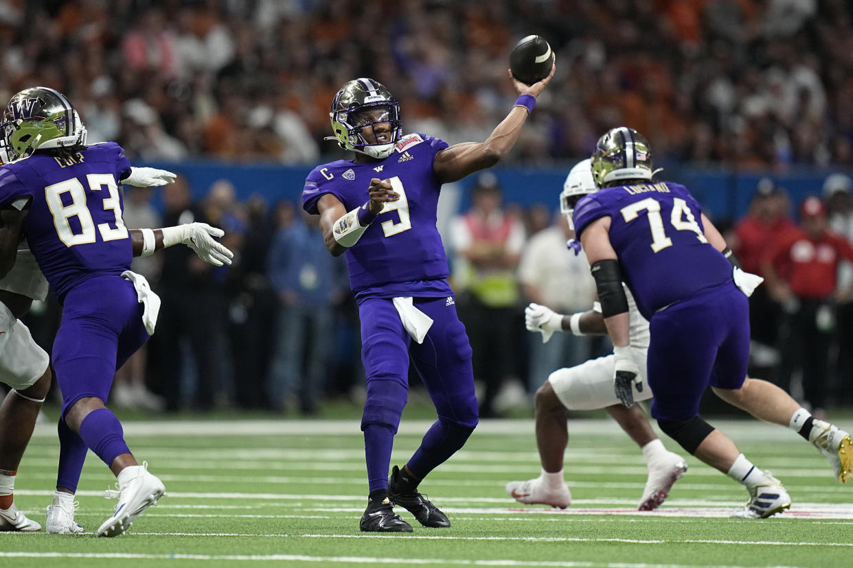 Washington quarterback Michael Penix Jr. (9) throws against Texas during the first half of the Alamo Bowl NCAA college football game in San Antonio, Thursday, Dec. 29, 2022. (AP Photo/Eric Gay)