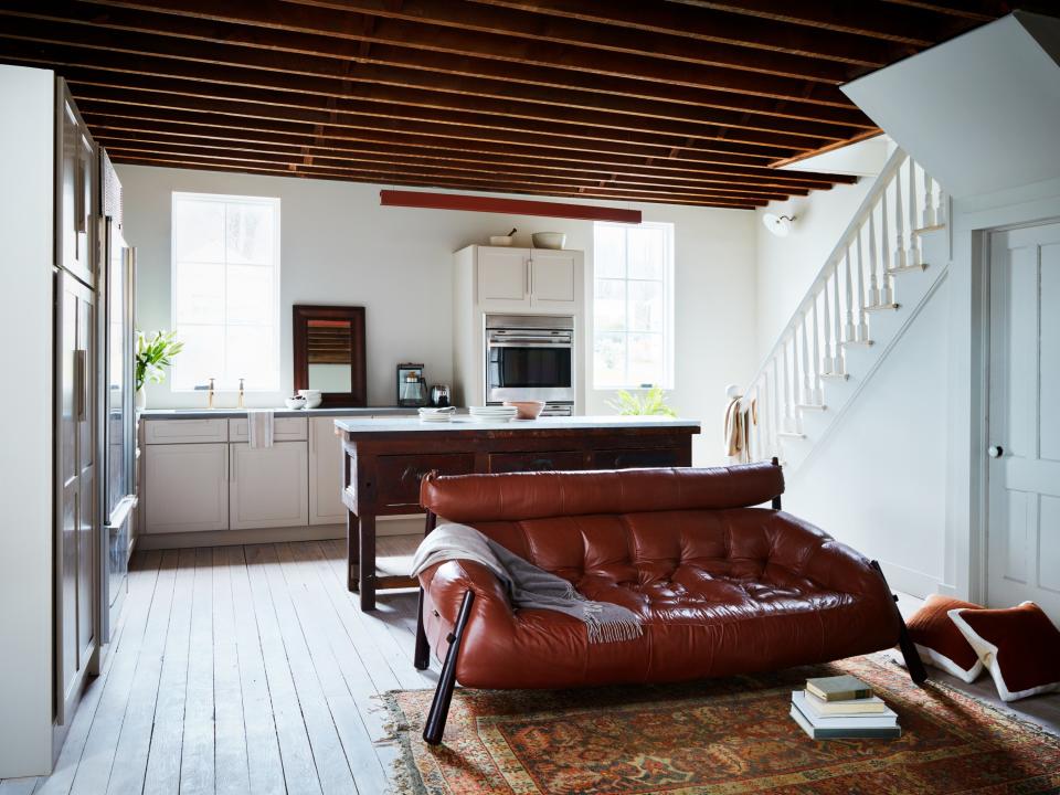 Sara and Sohail Zandi kept the exposed beams and joists on the ceiling because they loved the rugged charm. “The bones were really beautiful,” Sara says.