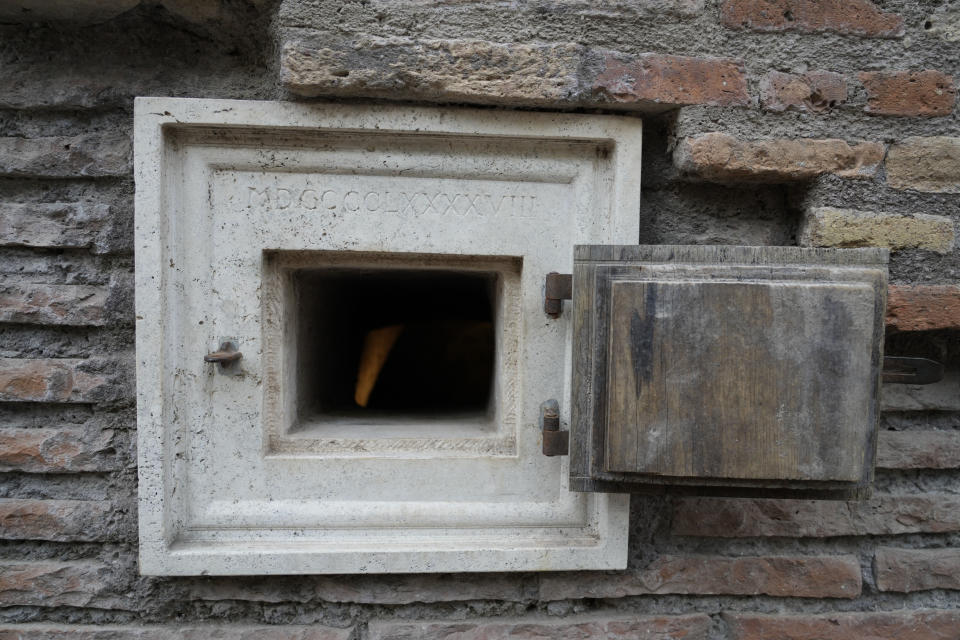 A window overlooks a fresco of flowers inside a lavatory of the newly restored domus Tiberiana, one of the main imperial palaces, during the press preview on Rome's Palatine Hill, in Rome, Italy, Wednesday, Sept. 20, 2023. The Domus Tiberiana will reopen to the public on Sept. 21. (AP Photo/Gregorio Borgia)