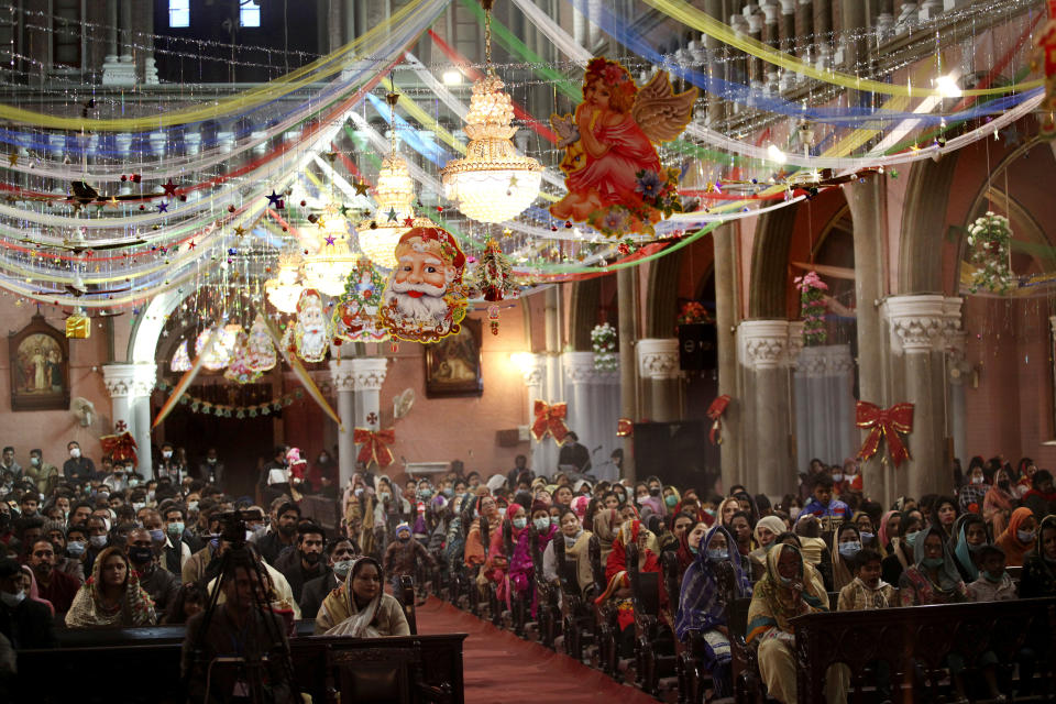 Christians attend a Christmas mass in Sacred Heart Cathedral in Lahore, Pakistan, Friday, Dec. 25, 2020. (AP Photo/K.M. Chaudary)