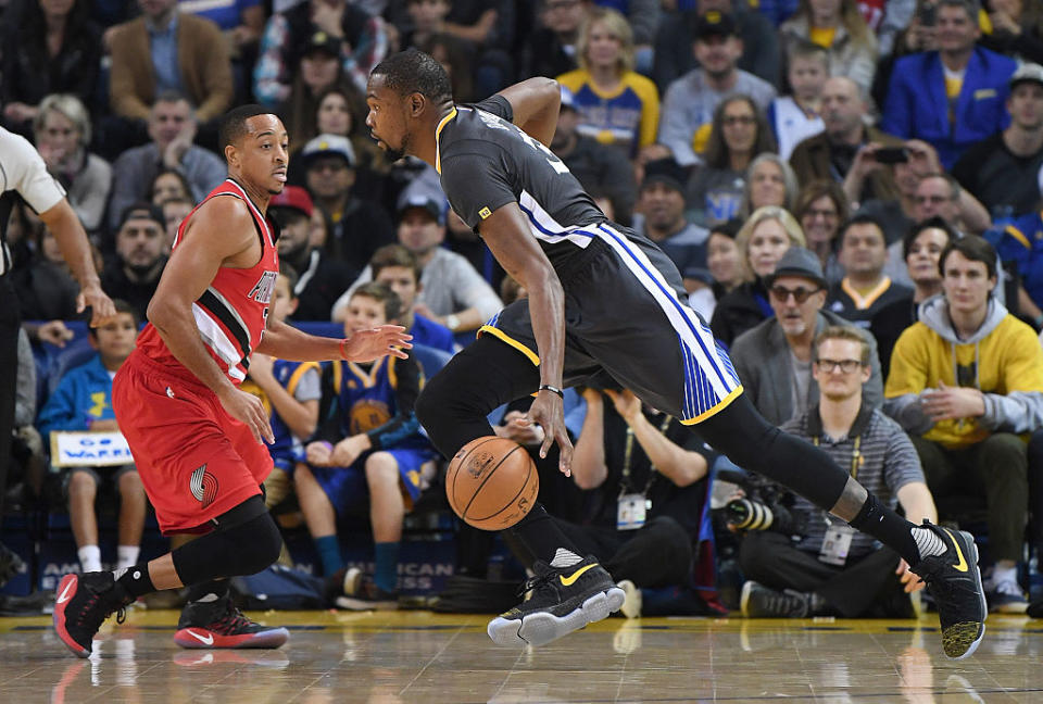 C.J. McCollum and the Blazers have been chasing Kevin Durant and the Warriors for years now. (Getty Images)