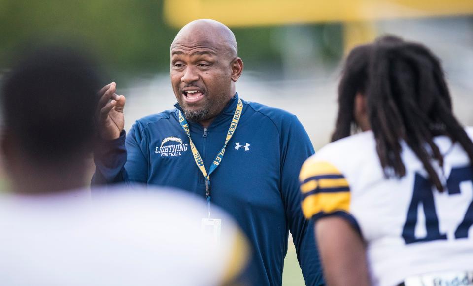 Lehigh Senior High School football coach James Chaney speaks to his team before a preseason game against Naples High School on Friday, August 20, 2021. 