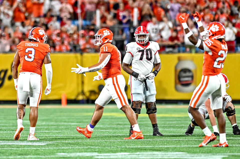 Sep 4, 2021; Charlotte, North Carolina, USA; Clemson Tigers defensive end <a class="link " href="https://sports.yahoo.com/ncaaf/players/287633/" data-i13n="sec:content-canvas;subsec:anchor_text;elm:context_link" data-ylk="slk:Xavier Thomas;sec:content-canvas;subsec:anchor_text;elm:context_link;itc:0">Xavier Thomas</a> (3) celebrates with defensive lineman <a class="link " href="https://sports.yahoo.com/nfl/players/40045/" data-i13n="sec:content-canvas;subsec:anchor_text;elm:context_link" data-ylk="slk:Bryan Bresee;sec:content-canvas;subsec:anchor_text;elm:context_link;itc:0">Bryan Bresee</a> (11) after a play during the first quarter against the Georgia Bulldogs at Bank of America Stadium. Mandatory Credit: Griffin Zetterberg-USA TODAY Sports