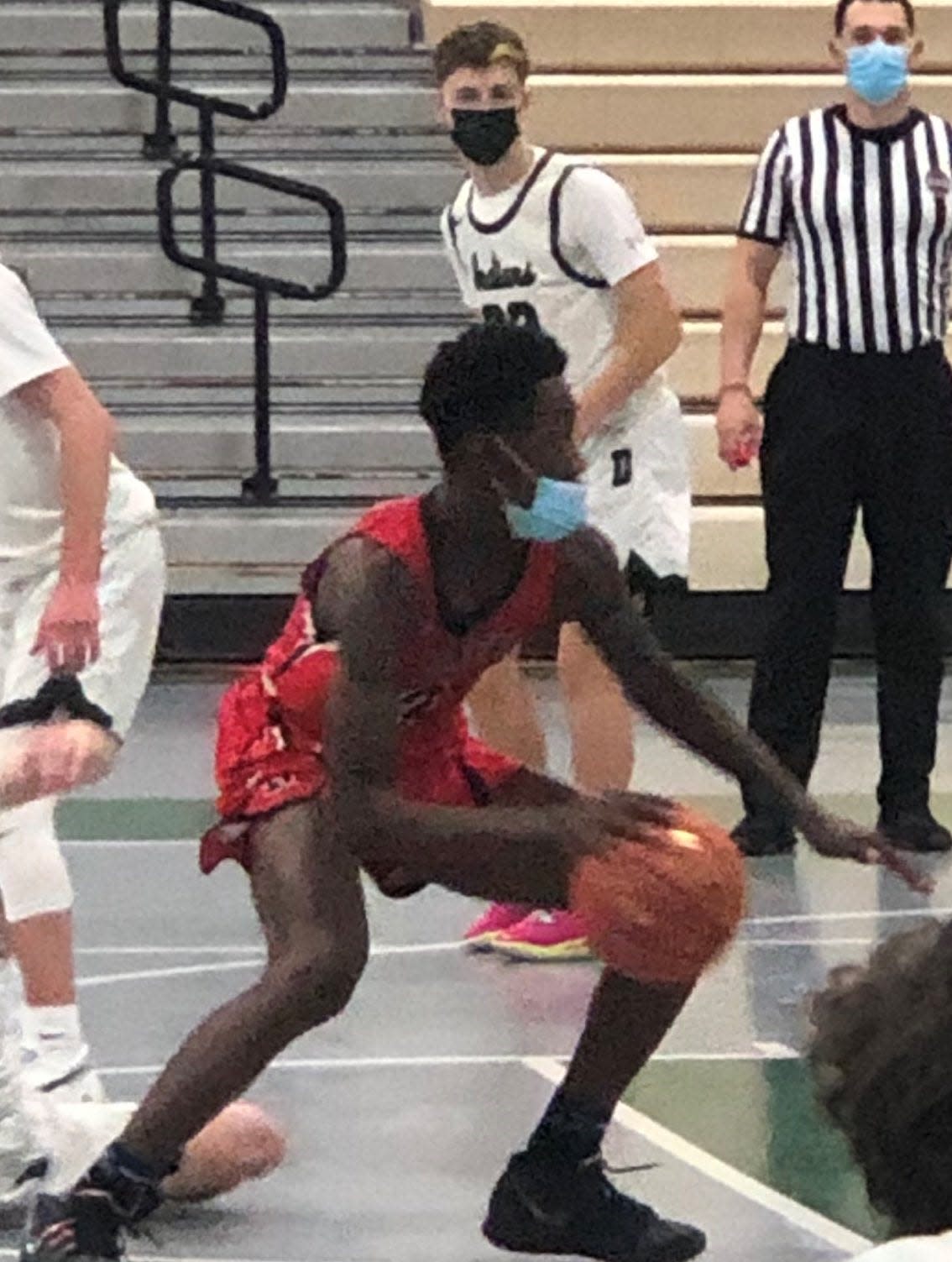 B.M.C. Durfee High School's Joson Sanon drives to the basket in a 2021 game against Dartmouth at Dartmouth High school.