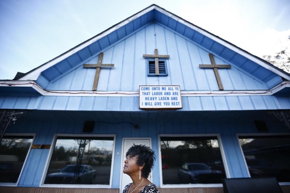 In this Jan. 18, 2017 photo, Chrycynthia Davis, mother of Kharon Davis, poses for a portrait in Dothan, Ala. Kharon Davis was 22-years-old when he was arrested on a capitol murder charge in 2007 and booked into the Houston County Jail. Davis has spent nearly a third of his life held without bond in the jail waiting for trial. (AP Photo/Brynn Anderson)