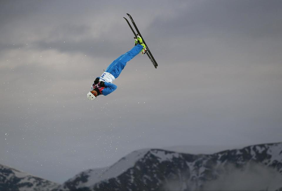 Anton Kushnir of Belarus jumps during men's freestyle skiing aerials qualifying at the Rosa Khutor Extreme Park, at the 2014 Winter Olympics, Monday, Feb. 17, 2014, in Krasnaya Polyana, Russia.(AP Photo/Sergei Grits)