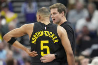 Utah Jazz head coach Will Hardy, right, speaks with guard Talen Horton-Tucker (5) during the second half of an NBA basketball game against the Denver Nuggets Tuesday, April 9, 2024, in Salt Lake City. (AP Photo/Rick Bowmer)