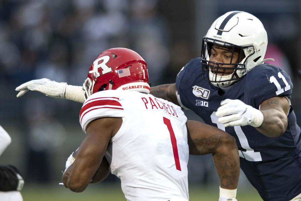 File-This Nov. 30, 2019, file photo shows Penn State linebacker Micah Parsons (11) tackling Rutgers running back Isaih Pacheco during an NCAA college football game in State College, Pa. Caleb Farley of Virginia Tech was the first top prospect to make the decision that has added a whole new layer of uncertainty to the annual crapshoot that is the NFL draft. Farley had plenty of players follow his lead, including several others set to be high draft picks next week like LSU receiver Chase, Oregon tackle Penei Sewell, Northwestern tackle Rashawn Slater, and Parsons. (AP Photo/Barry Reeger, File)