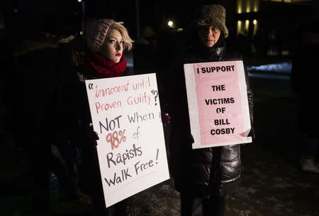 Protesters demonstrate against Bill Cosby, outside the Centre In The Square venue where the comedian is performing, in Kitchener, January 7, 2015. REUTERS/Mark Blinch