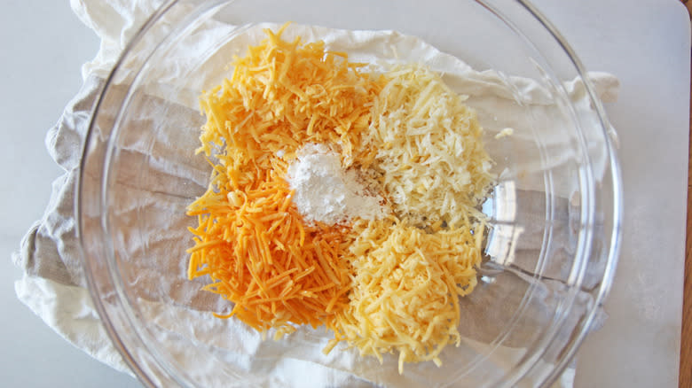 Four grated cheeses in bowl