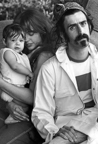 <p>Michael Ochs Archives/Getty</p> Moon Unit Zappa, Gail Zappa and Frank Zappa in 1968.