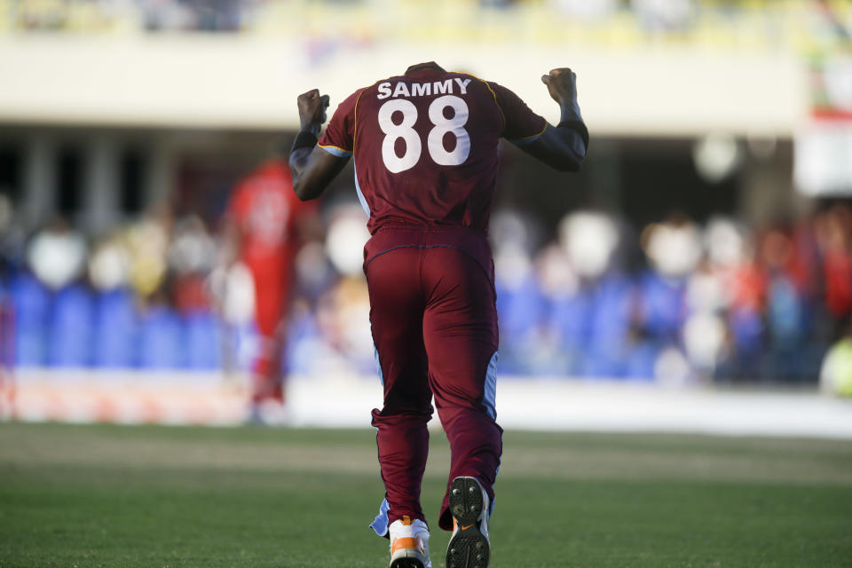 West Indies' Darren Sammy celebrates his team's 269/6 to 254/5 win over England during their first one-day international cricket match at the Sir Vivian Richards Cricket Ground in St. John's, Antigua, Friday, Feb. 28, 2014. (AP Photo/Ricardo Mazalan)