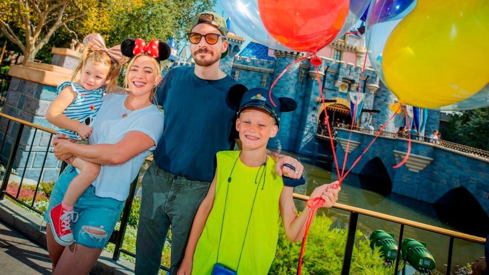 PHOTO: In this handout photo provided by Disneyland Resorts, Hilary Duff with her husband Matthew Koma, their daughter Banks, 2, and Duff's son Luca, 9, while spending the day at Disneyland Park in Anaheim, CA, July 23, 2021. (Christian Thompson/Getty Images)