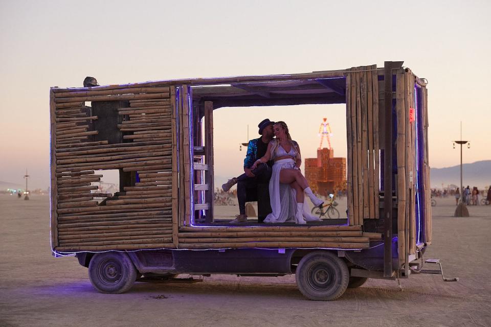 Ari and Chase on their art car at their Burning Man wedding