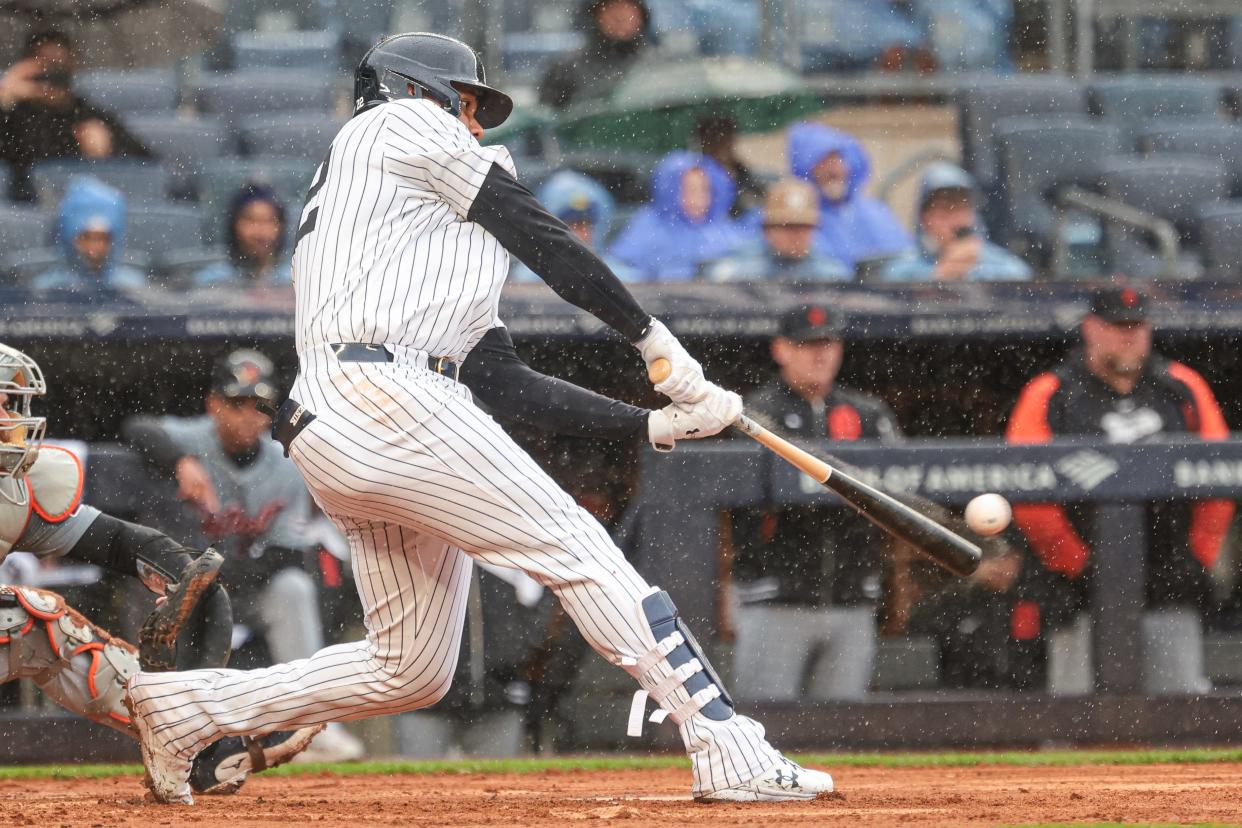 May 5, 2024; Bronx, New York, USA; New York Yankees right fielder Juan Soto (22) hits a three RBI double during the seventh inning against the Detroit Tigers at Yankee Stadium. Mandatory Credit: Vincent Carchietta-USA TODAY Sports