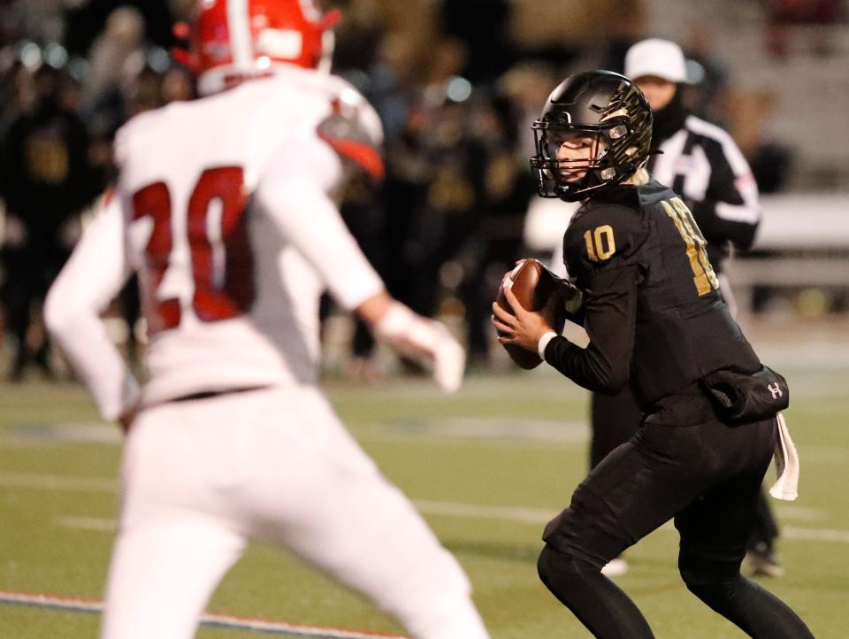 Bushland’s Dawson Jaco looks for an open receiver in the first half. Bushland faces Jim Ned in a football playoff game, Friday, Nov. 18, 2022, at Lowrey Field PlainsCapital Park. 