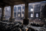 The remains of the library at the University of Cape Town, South Africa, Monday, April 19, 2021 after it burned down Sunday. People were evacuated from Cape Town neighborhoods as a raging wildfire sweeping across the slopes of the city’s famed Table Mountain was fanned by high winds and threatened homes. City authorities said the fire, which started early Sunday, was still not under control. The blaze has already burned the library and other buildings on the campus of the University of Cape Town. (AP Photo)