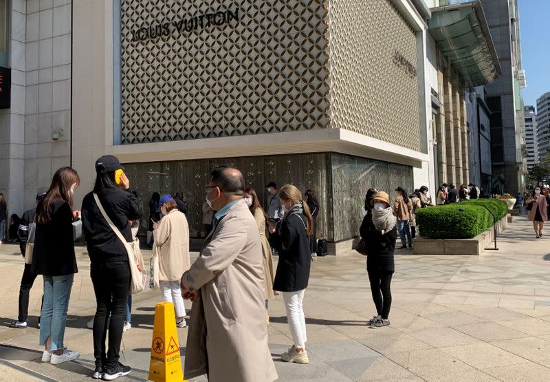 People queue to enter the Chanel boutique at a department store amid the coronavirus disease (COVID-19) outbreak, in Seoul