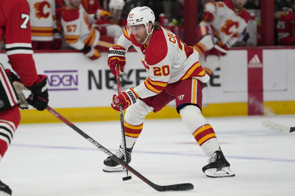 Calgary Flames center Blake Coleman handles the puck during the second period of an NHL hockey game against the Chicago Blackhawks, Sunday, Jan. 7, 2024, in Chicago. (AP Photo/Erin Hooley)