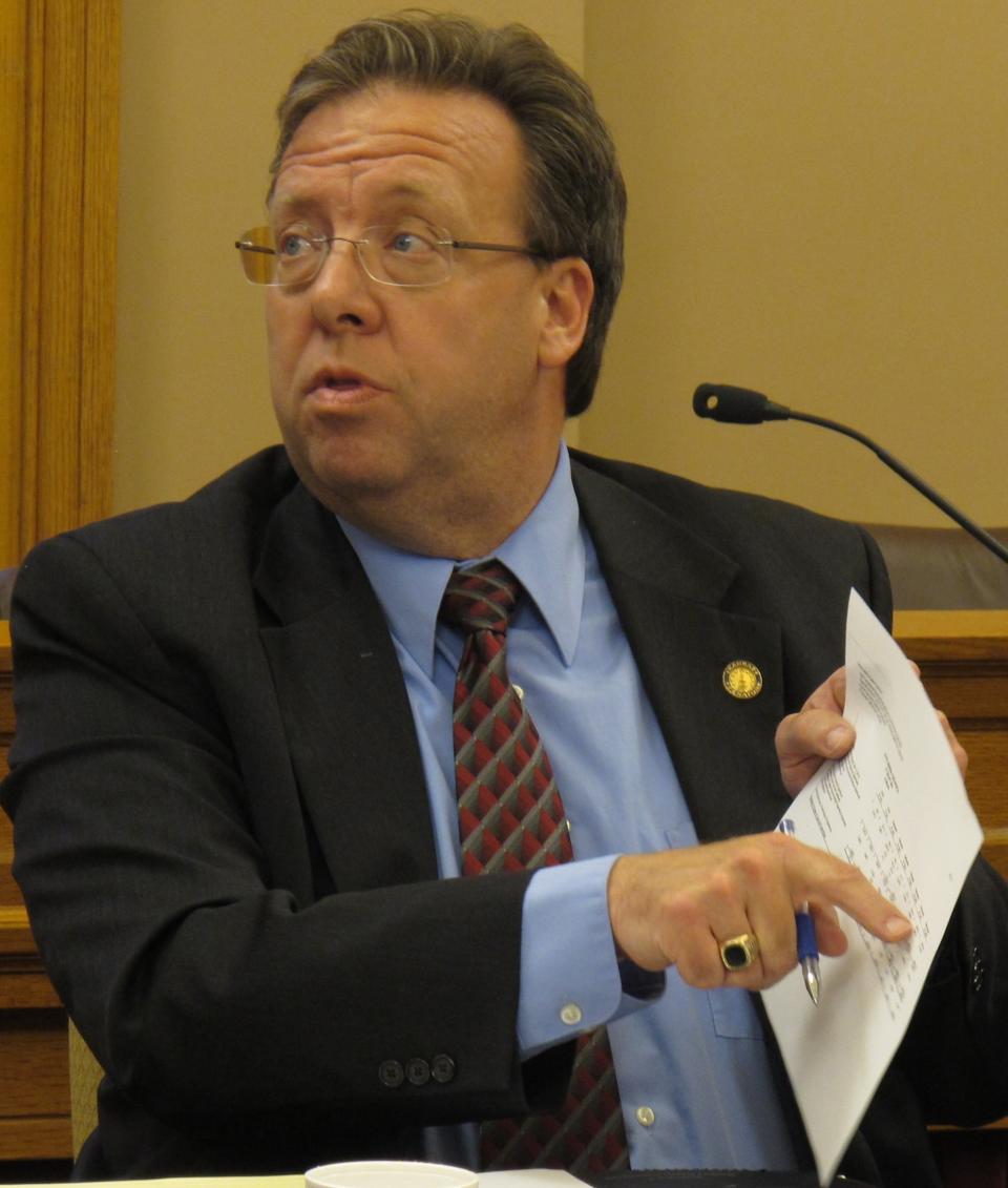 Kansas state Sen. Tom Holland, a Baldwin City Democrat, asks questions about new projections for how a plan to cut sales and income taxes would affect the state budget, Monday, April 30, 2012, at the Statehouse, in Topeka, Kan. Kansas legislators who are pushing for income tax cuts said Monday they're willing to tinker with their latest plan to avoid a budget shortfall and address a big concern of a bipartisan group already skeptical of the proposal. (AP Photo/John Hanna)