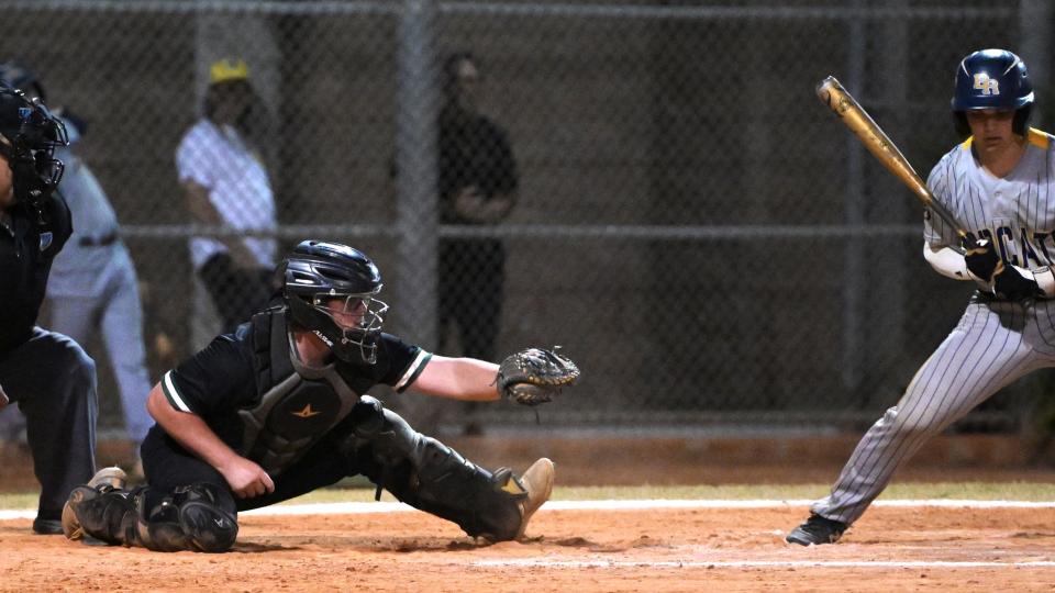 Suncoast catcher Brady King extends his leg as he receives a pitch from Brady Benevides during a regular season game against Boca Raton on Mar. 28, 2024.