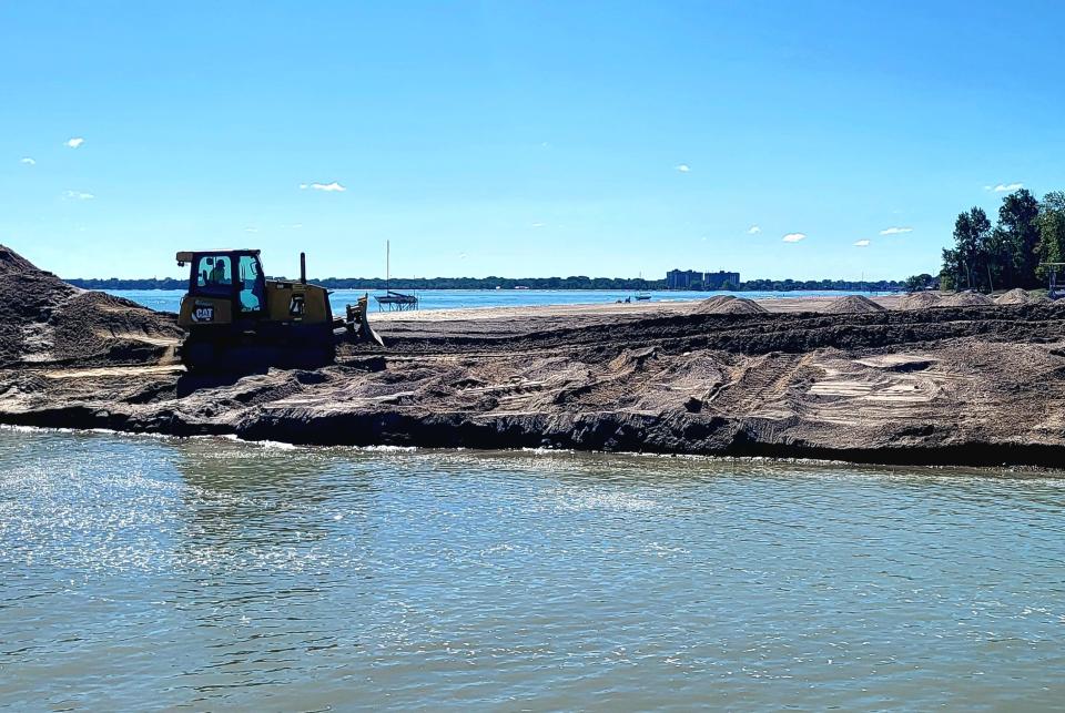 Dirt is pushed away from the edge of the Black River Canal on Thursday, Aug. 31, 2023. It marked the fourth dredging this season.